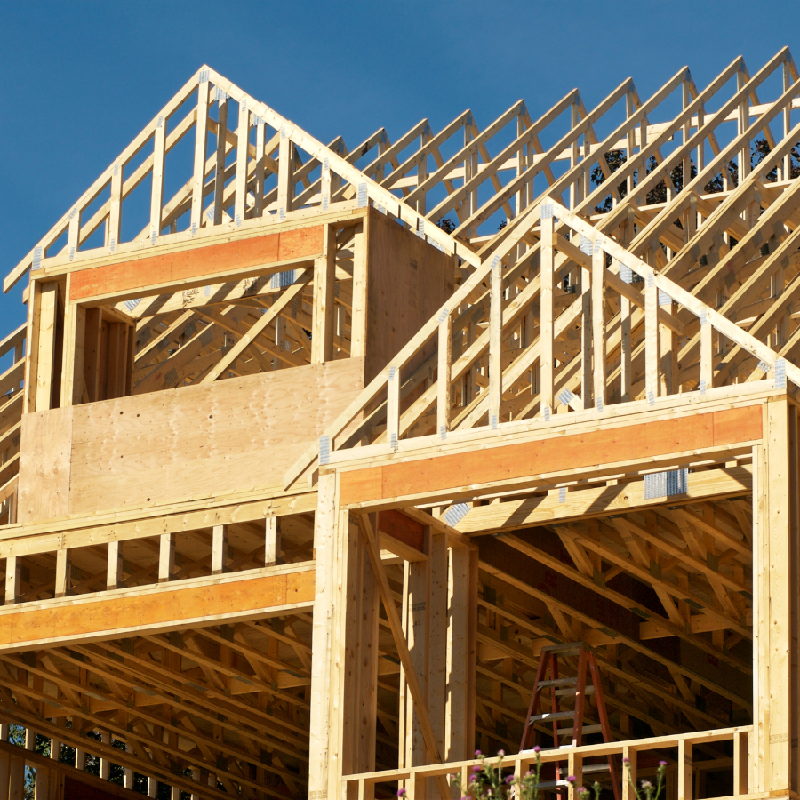 A house in the framing phase of construction. schedule a wdi inspection page